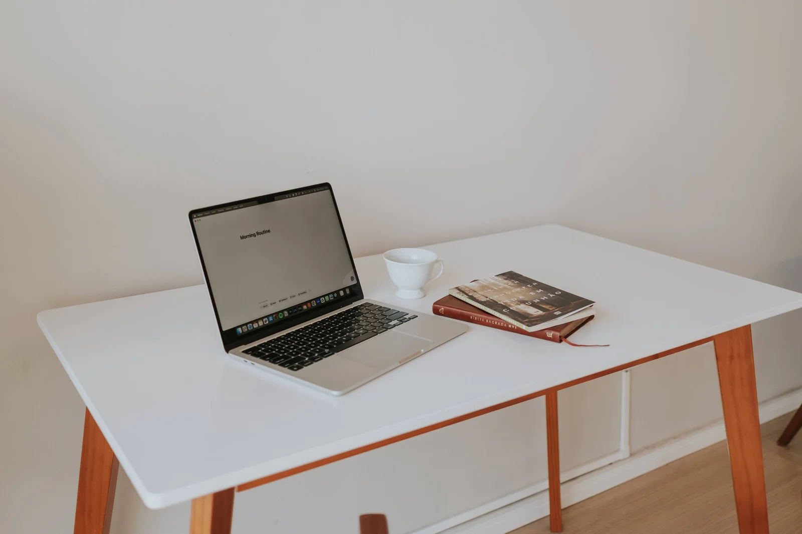 Compact workspace with a laptop and books